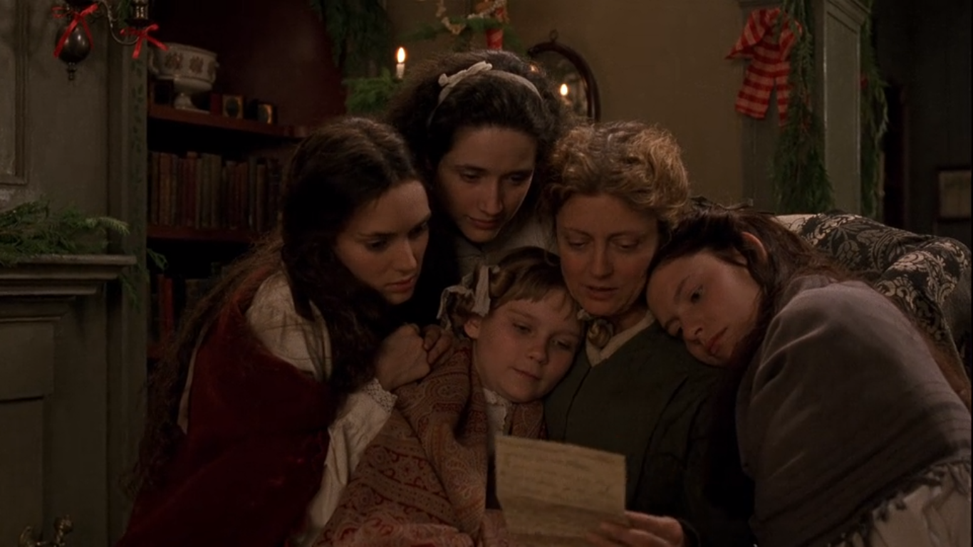 Mrs. March reads a letter from her husband to her four daughters in a scene from Little Women. 