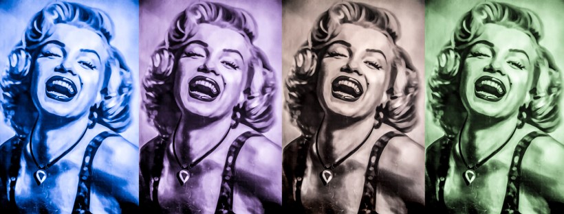 Four identical side-by-side portraits of Marilyn Monroe smiling.